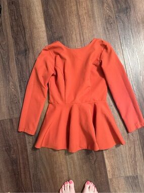 Long Sleeve Peplum Blouse in Vibrant Orange